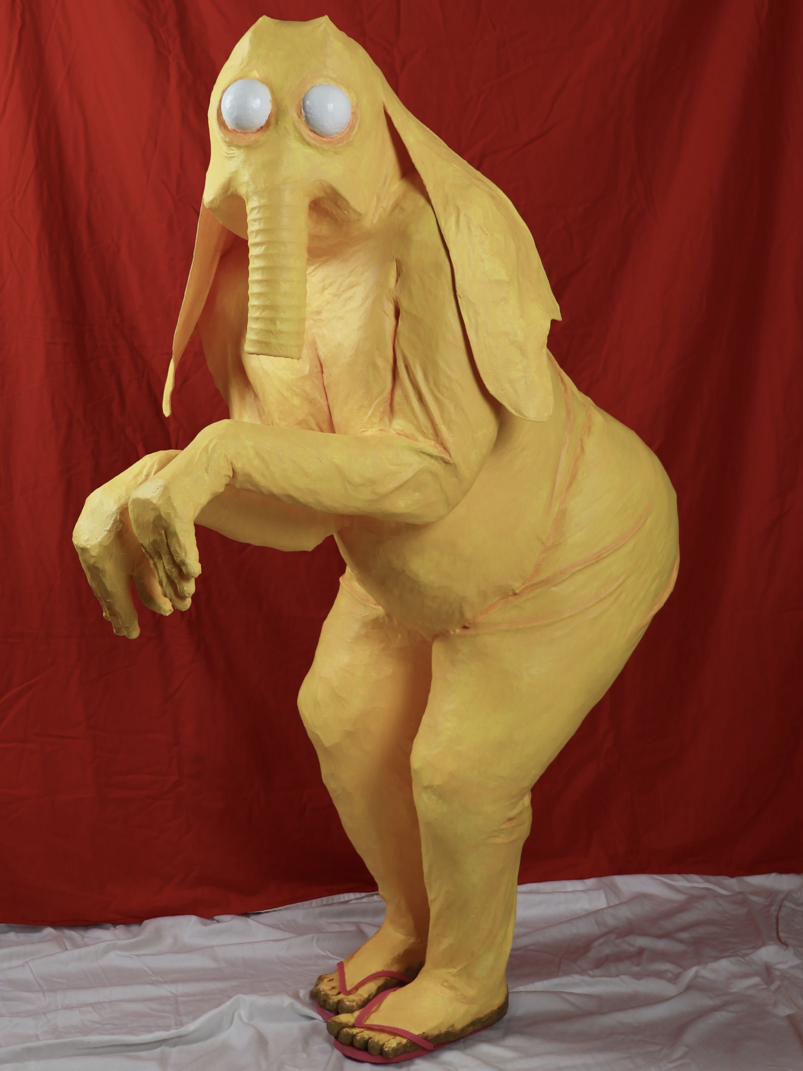 A yellow humanoid elephant