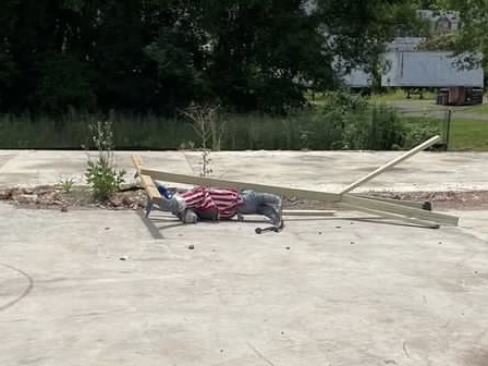 Scarecrow vandalized and thrown on the ground