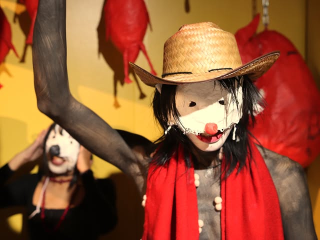 A clown raises a cleaver